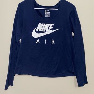 Dark blue Nike long sleeve shirt. Women’s size large but fits like a medium.
